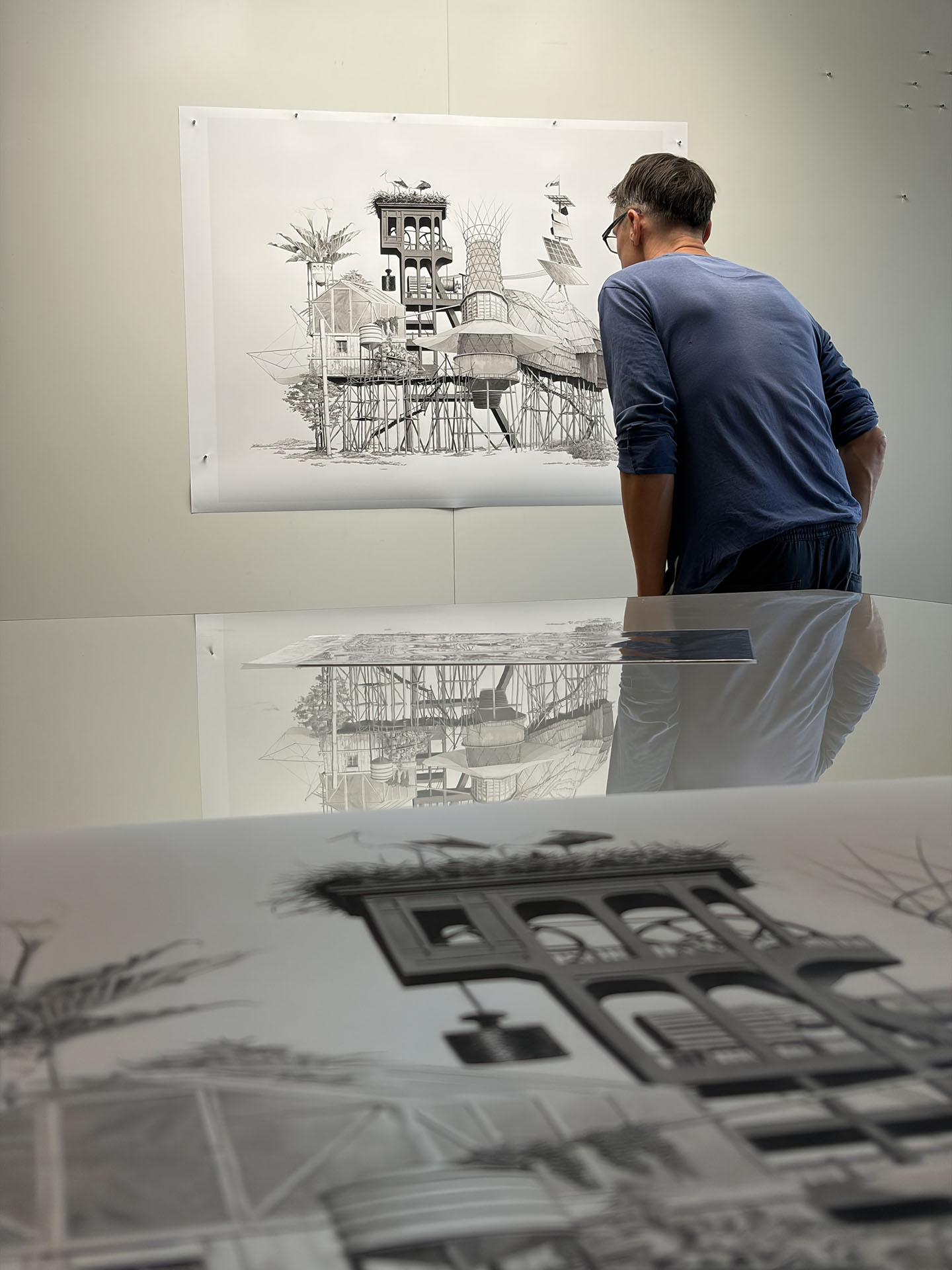 Ludovic Duprez examining the original drawing during the Piezography process